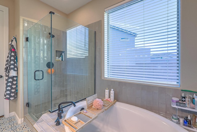 2350 Sandra Loop NE, Rio Rancho, NM 87144 - bathroom featuring a shower stall, healthy amount of natural light, and a bath