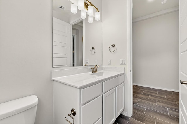 215 Adeline Ave, Los Lunas, NM 87031 - bathroom featuring vanity and wood tiled floors