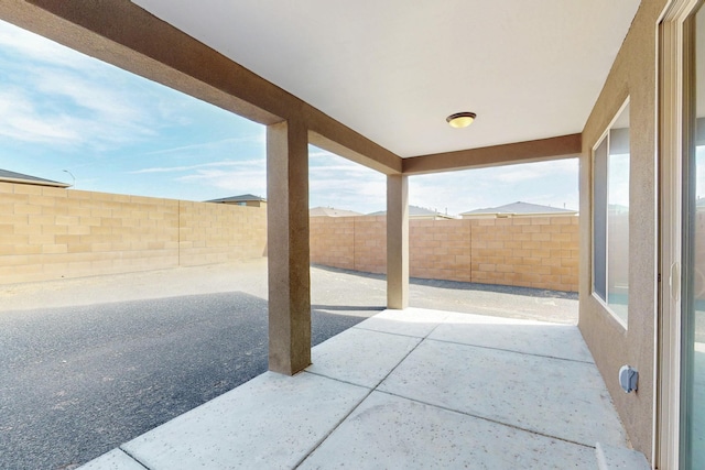 215 Adeline Ave, Los Lunas, NM 87031 - fenced backyard with a patio