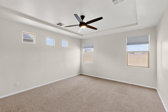 275 Adeline Ave, Los Lunas, NM 87031 - carpeted empty room featuring a tray ceiling and a ceiling fan