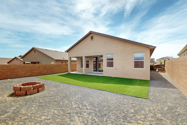 275 Adeline Ave, Los Lunas, NM 87031 - back of house featuring a fenced backyard, a patio, and stucco siding