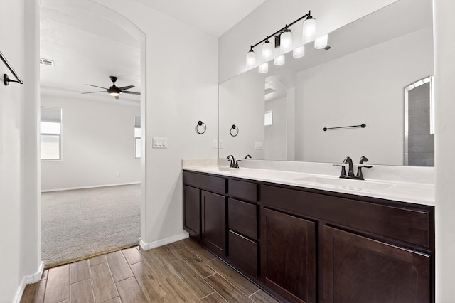 275 Adeline Ave, Los Lunas, NM 87031 - full bathroom featuring ceiling fan, double vanity, and wood finish floors