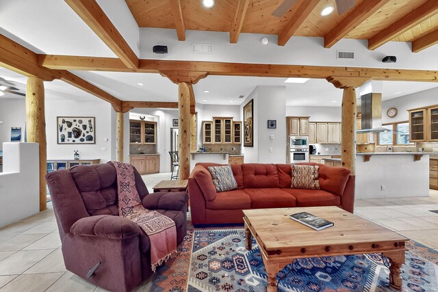317 Plaza Muchomas, Bernalillo, NM 87004 - living area with light tile patterned floors, a wooden ceiling with exposed beams, recessed lighting, a chandelier, and a fireplace