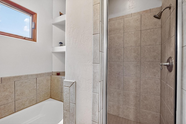 317 Plaza Muchomas, Bernalillo, NM 87004 - bathroom with a garden tub, a shower stall, and a textured wall
