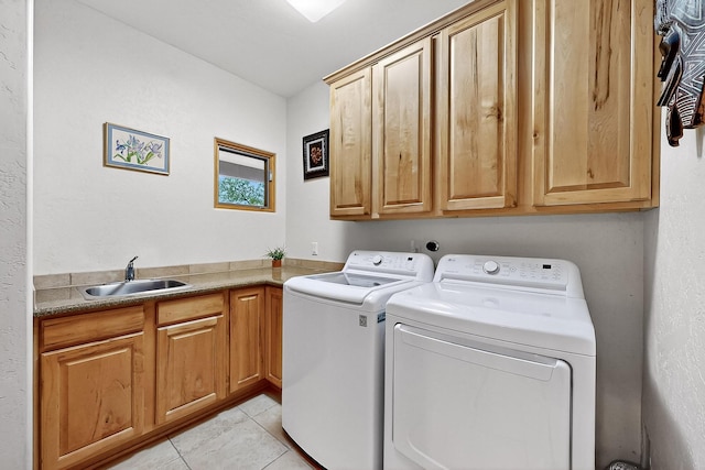 317 Plaza Muchomas, Bernalillo, NM 87004 - laundry area featuring cabinet space, washing machine and dryer, and light tile patterned flooring