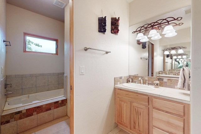 317 Plaza Muchomas, Bernalillo, NM 87004 - full bathroom featuring vanity, a garden tub, and tile patterned flooring