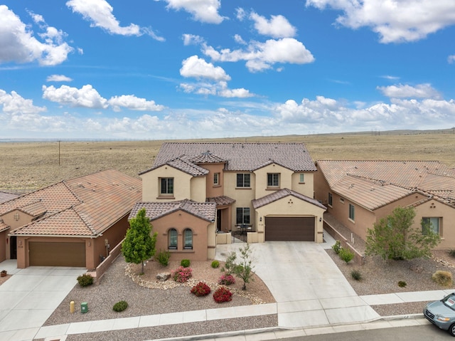 9128 Vista Bosquejo Rd NW, Albuquerque, NM 87120 - mediterranean / spanish-style house with driveway, a garage, stucco siding, and a tile roof
