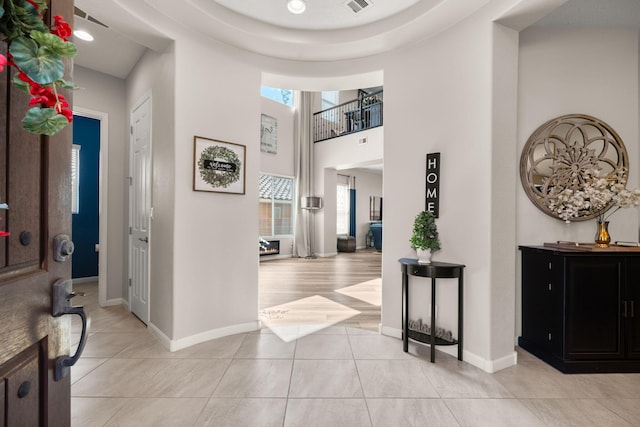 9128 Vista Bosquejo Rd NW, Albuquerque, NM 87120 - foyer entrance featuring light tile patterned flooring, a high ceiling, and recessed lighting