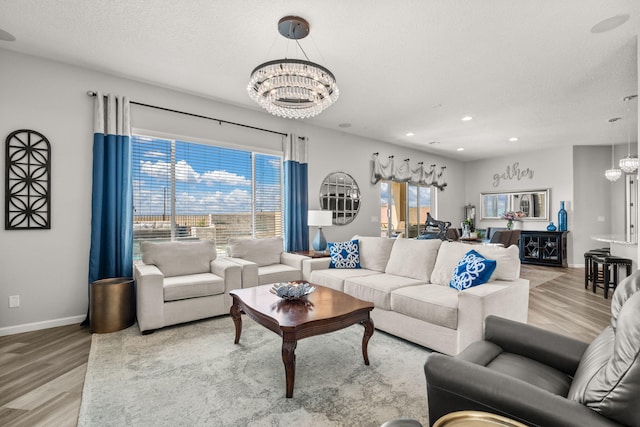9128 Vista Bosquejo Rd NW, Albuquerque, NM 87120 - living room with a chandelier, light wood-style floors, recessed lighting, and a textured ceiling