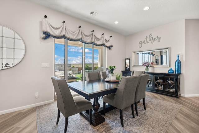 9128 Vista Bosquejo Rd NW, Albuquerque, NM 87120 - dining room with light wood-style floors, recessed lighting, and a textured ceiling