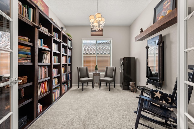 9128 Vista Bosquejo Rd NW, Albuquerque, NM 87120 - sitting room with carpet floors, wall of books, a chandelier, and a textured ceiling