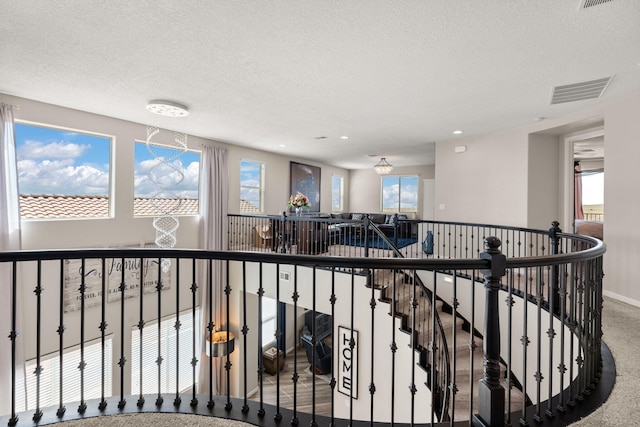 9128 Vista Bosquejo Rd NW, Albuquerque, NM 87120 - corridor featuring carpet flooring, recessed lighting, a textured ceiling, and an upstairs landing