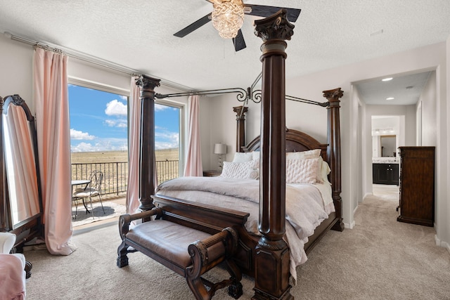 9128 Vista Bosquejo Rd NW, Albuquerque, NM 87120 - bedroom featuring light carpet, access to exterior, a textured ceiling, and ceiling fan