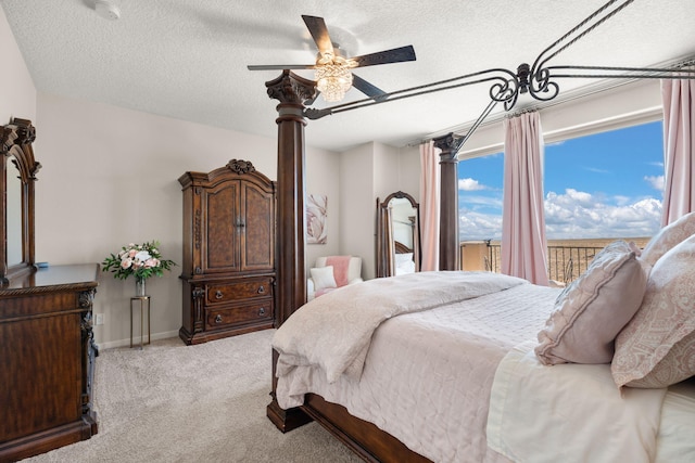 9128 Vista Bosquejo Rd NW, Albuquerque, NM 87120 - bedroom with a textured ceiling, light carpet, and a ceiling fan