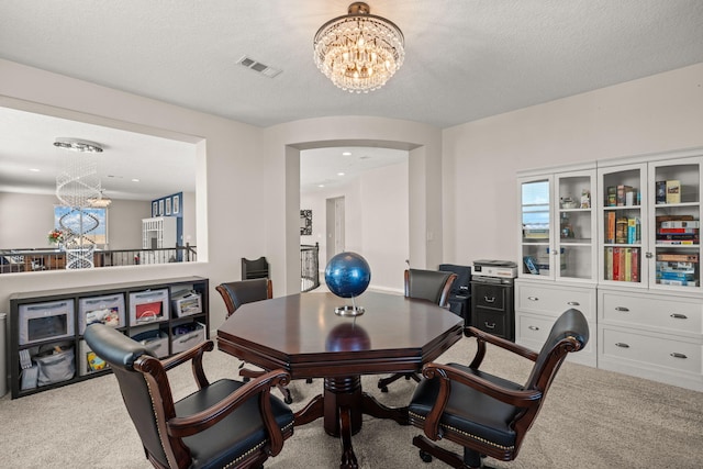 9128 Vista Bosquejo Rd NW, Albuquerque, NM 87120 - dining room with a chandelier, carpet flooring, arched walkways, and recessed lighting
