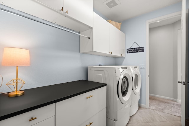 9128 Vista Bosquejo Rd NW, Albuquerque, NM 87120 - washroom featuring cabinet space, separate washer and dryer, and light tile patterned floors