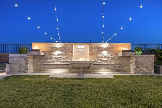 9128 Vista Bosquejo Rd NW, Albuquerque, NM 87120 - patio at twilight with a lawn