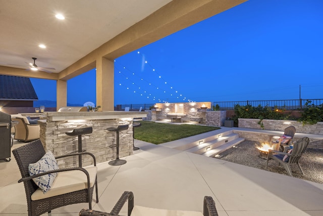 9128 Vista Bosquejo Rd NW, Albuquerque, NM 87120 - view of patio featuring an outdoor fire pit