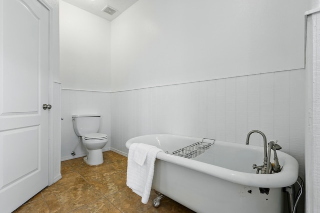 2061 Blaylock Ln NE, Los Lunas, NM 87031 - full bath with a wainscoted wall and a soaking tub