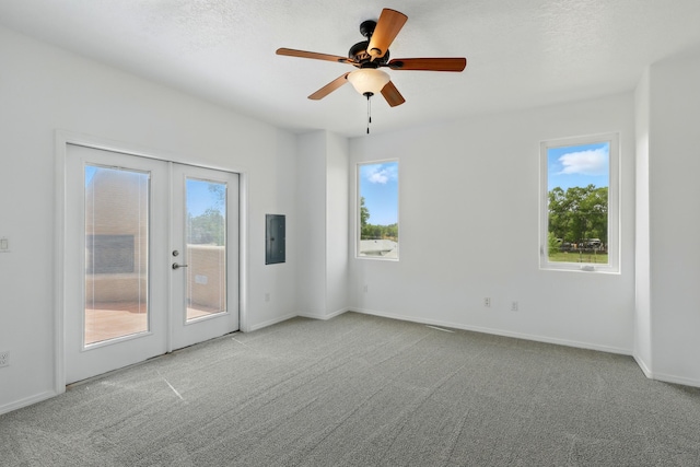 2061 Blaylock Ln NE, Los Lunas, NM 87031 - spare room featuring french doors, carpet, a ceiling fan, and electric panel