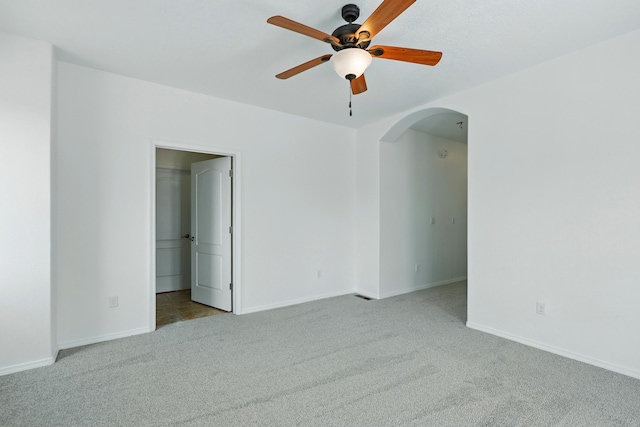 2061 Blaylock Ln NE, Los Lunas, NM 87031 - carpeted empty room featuring arched walkways and a ceiling fan