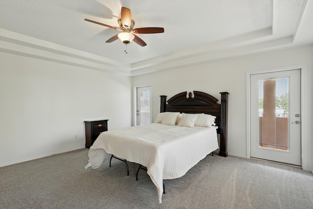 2061 Blaylock Ln NE, Los Lunas, NM 87031 - carpeted bedroom with a tray ceiling and ceiling fan