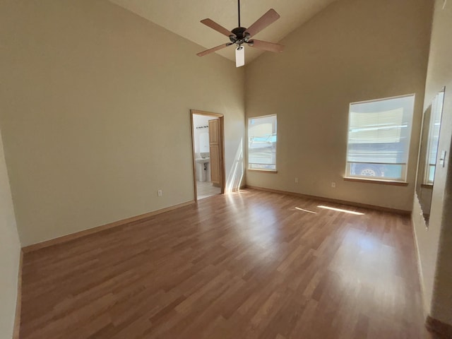 2172 Sonora Rd NE, Rio Rancho, NM 87144 - unfurnished room with wood finished floors, a ceiling fan, high vaulted ceiling, and baseboards