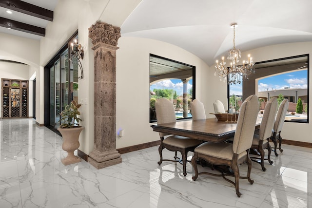 10650 Signal Ave NE, Albuquerque, NM 87122 - dining area featuring baseboards, light marble finish flooring, a chandelier, and lofted ceiling