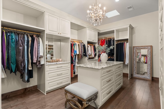 10650 Signal Ave NE, Albuquerque, NM 87122 - spacious closet featuring dark wood finished floors and a chandelier