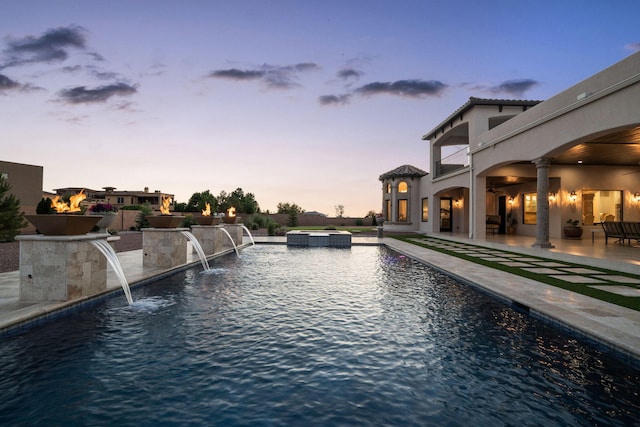10650 Signal Ave NE, Albuquerque, NM 87122 - pool at dusk with a patio area and a pool with connected hot tub