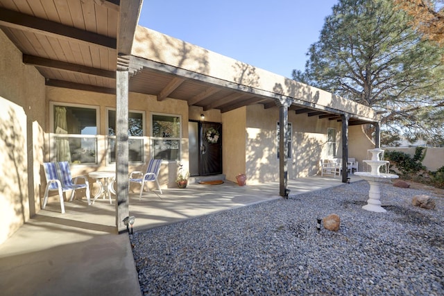 3900 Embudito Dr NE, Albuquerque, NM 87111 - property entrance featuring stucco siding and a patio