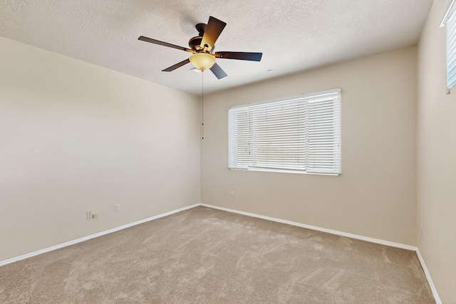 11024 Fort Point Ln NE Unit B, Albuquerque, NM 87123 - unfurnished room with carpet, ceiling fan, baseboards, and a textured ceiling
