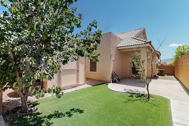 805 Palo Duro Dr, Bernalillo, NM 87004 - view of front of property featuring stucco siding, a tiled roof, central AC unit, and a patio