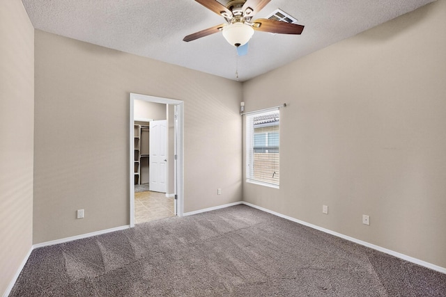 805 Palo Duro Dr, Bernalillo, NM 87004 - carpeted spare room with ceiling fan and a textured ceiling