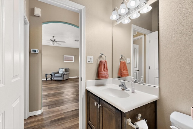 805 Palo Duro Dr, Bernalillo, NM 87004 - half bathroom with vanity, wood finished floors, and ceiling fan