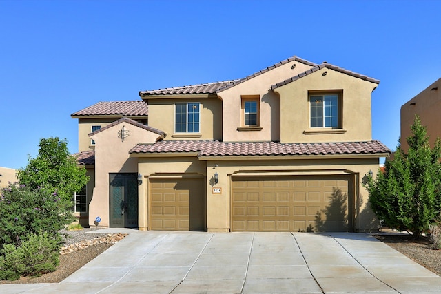 843 Mesa Roja Trl NE, Rio Rancho, NM 87124 - mediterranean / spanish-style house with an attached garage, driveway, stucco siding, and a tiled roof