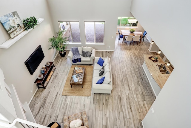 843 Mesa Roja Trl NE, Rio Rancho, NM 87124 - living room with wood finished floors and baseboards