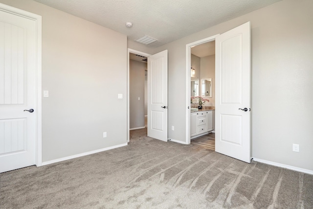 843 Mesa Roja Trl NE, Rio Rancho, NM 87124 - unfurnished bedroom with carpet, baseboards, and ensuite bath