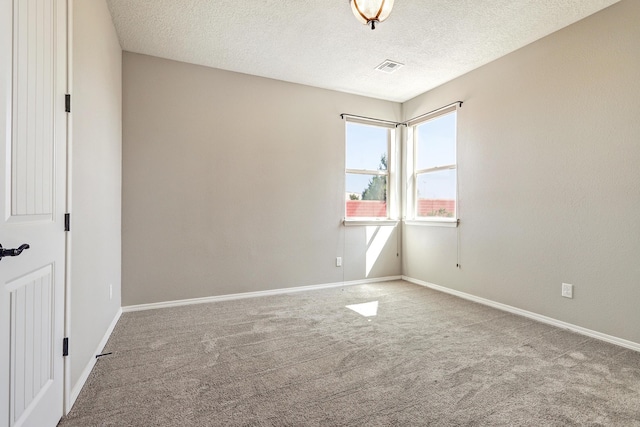 843 Mesa Roja Trl NE, Rio Rancho, NM 87124 - spare room with carpet, a textured ceiling, and baseboards