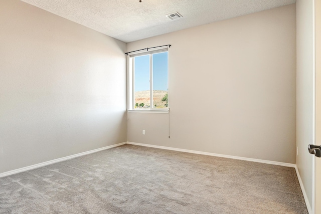 843 Mesa Roja Trl NE, Rio Rancho, NM 87124 - unfurnished room featuring carpet floors, baseboards, and a textured ceiling