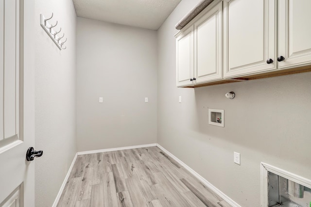 843 Mesa Roja Trl NE, Rio Rancho, NM 87124 - laundry room featuring cabinet space, light wood-style floors, hookup for a washing machine, and baseboards