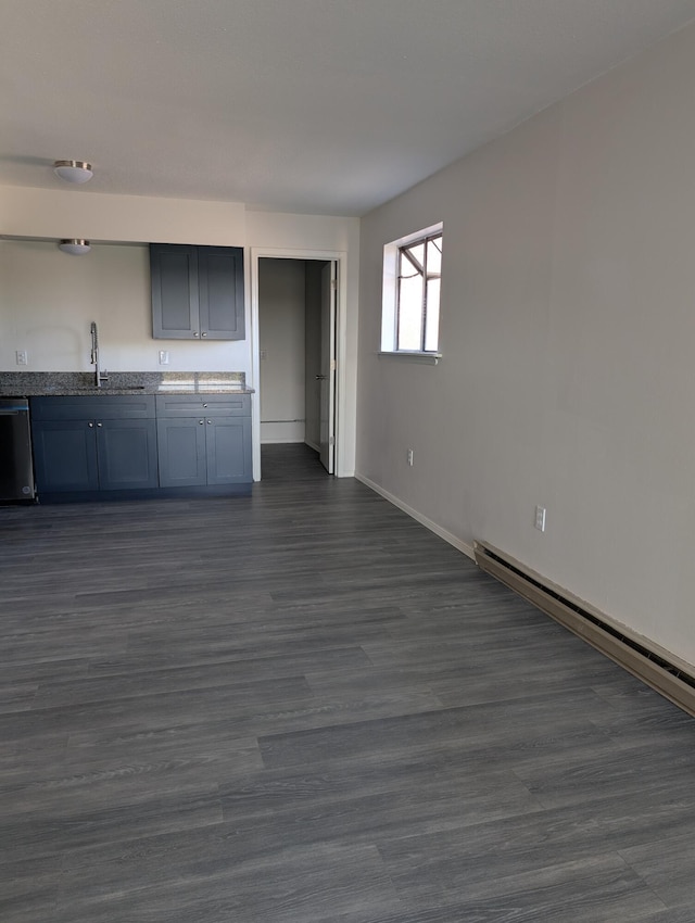 301 Stagecoach Dr, Elephant Butte, NM 87935 - kitchen with a sink, dishwasher, a baseboard radiator, baseboards, and dark wood-type flooring