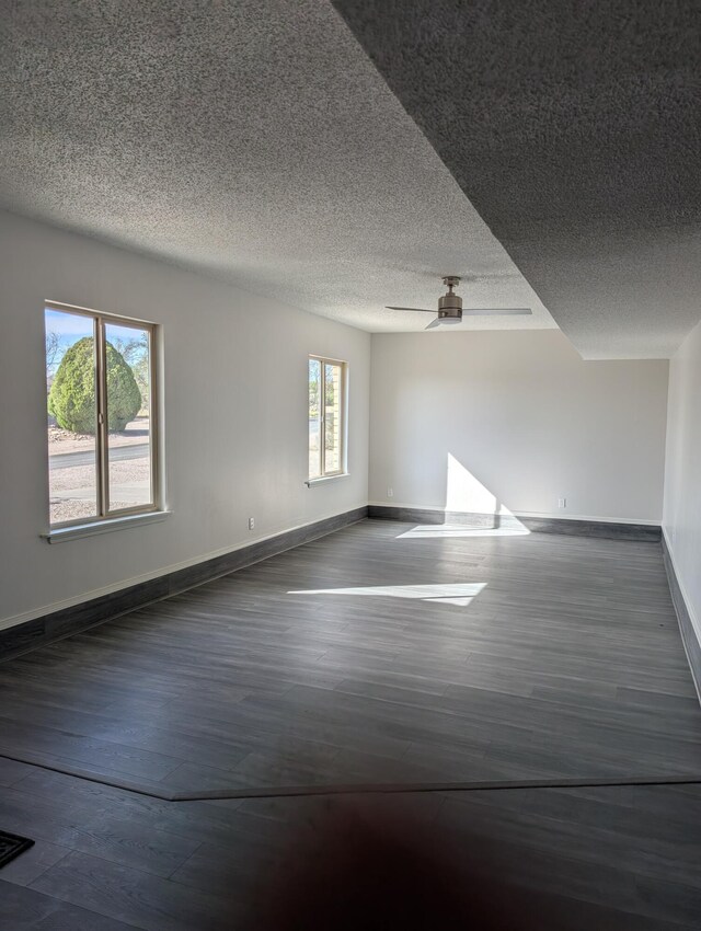 301 Stagecoach Dr, Elephant Butte, NM 87935 - unfurnished room with wood finished floors, baseboards, and a textured ceiling