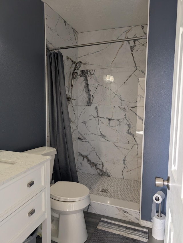 301 Stagecoach Dr, Elephant Butte, NM 87935 - bathroom with toilet, a marble finish shower, and vanity