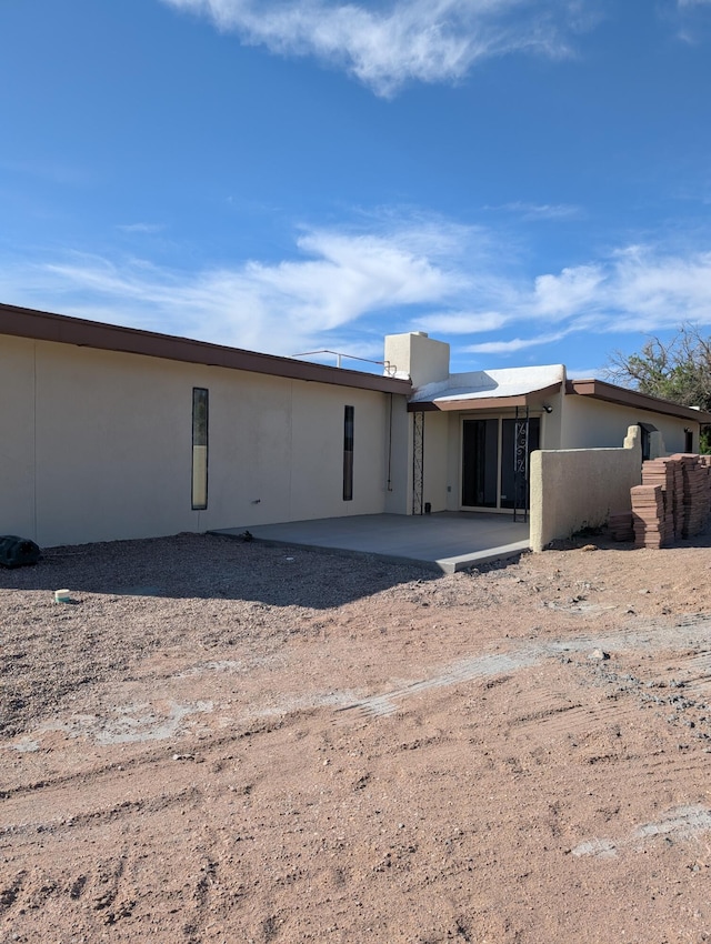 301 Stagecoach Dr, Elephant Butte, NM 87935 - rear view of house featuring a patio area and stucco siding