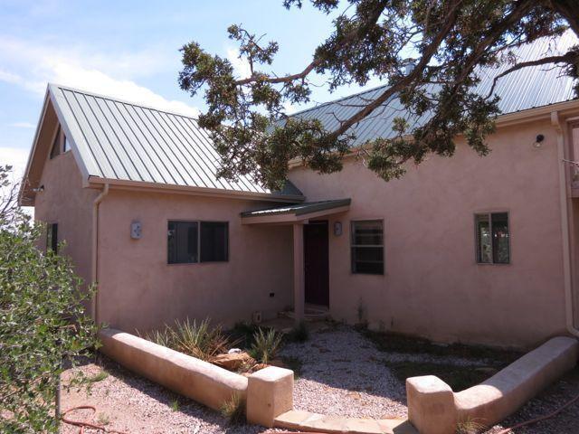403 Candy Kitchen Rd, Ramah, NM 87321 - view of front facade featuring a standing seam roof, stucco siding, and metal roof
