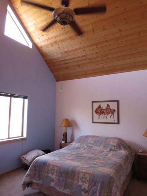 403 Candy Kitchen Rd, Ramah, NM 87321 - carpeted bedroom with wood ceiling and high vaulted ceiling