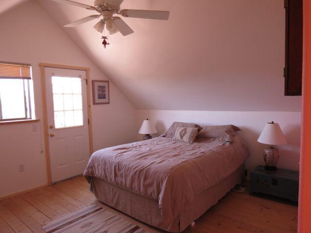 403 Candy Kitchen Rd, Ramah, NM 87321 - bedroom featuring hardwood / wood-style flooring, lofted ceiling, and ceiling fan