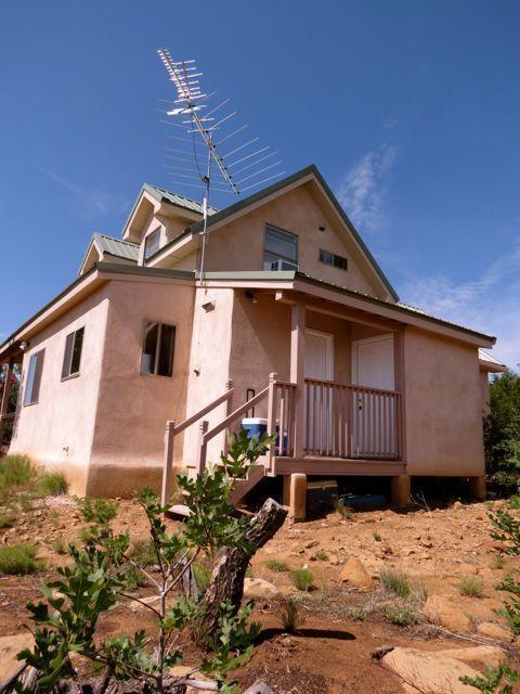 403 Candy Kitchen Rd, Ramah, NM 87321 - view of front of property with stucco siding and metal roof