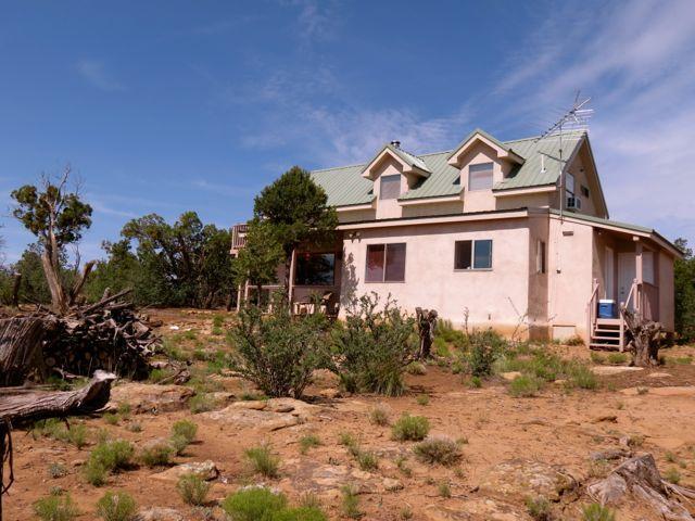 403 Candy Kitchen Rd, Ramah, NM 87321 - view of property exterior featuring stucco siding and metal roof